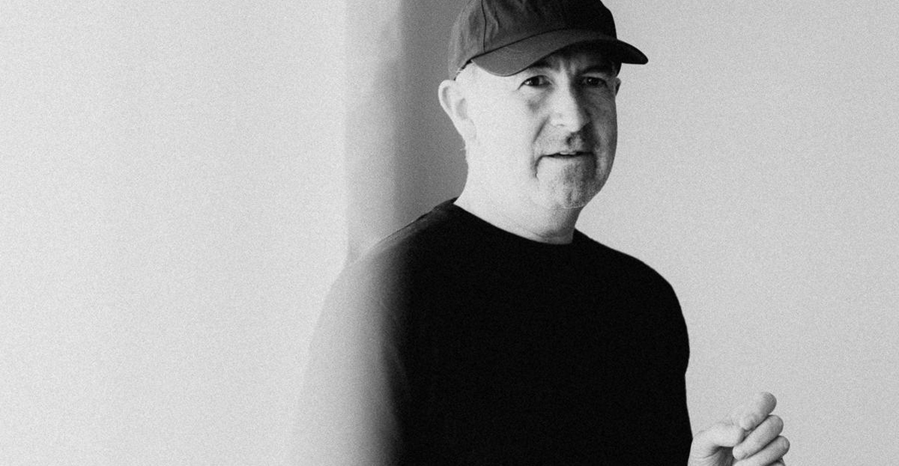Black-and-white portrait of Jordan Bramble in a cap and dark T-shirt